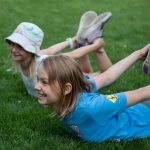 Kids are practicing Yoga outdoor with Stefanie Grace