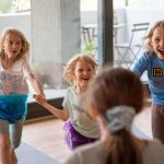 Kids having fun at the yoga studio together