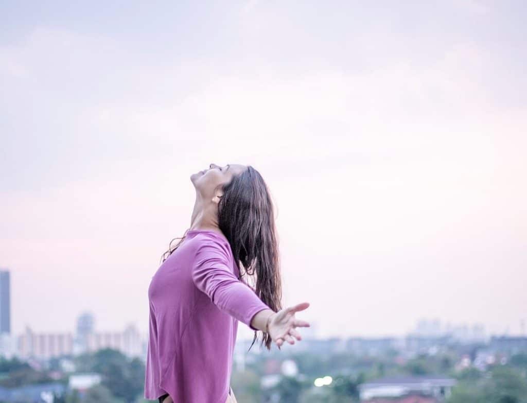 Open arms and smiling woman